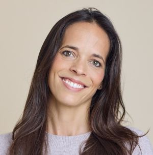 A head and shoulders photo of Alice Brown, a white female with long hair, smiling at the camera